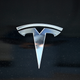 The Tesla logo is displayed on a Tesla car on April 26, 2021 in Corte Madera, California. Tesla will report first quarter earnings today after the closing bell.